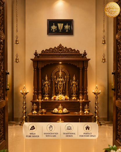 A traditional Indian Pooja mandir altar with Silver Shanku Chakra Nama decorated with brass lamps, hanging bells, and a white banner at the bottom displaying product features.